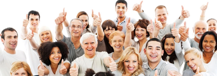 Group of people standing close together with their arms raised, giving thumbs-up gestures in a positive and supportive manner